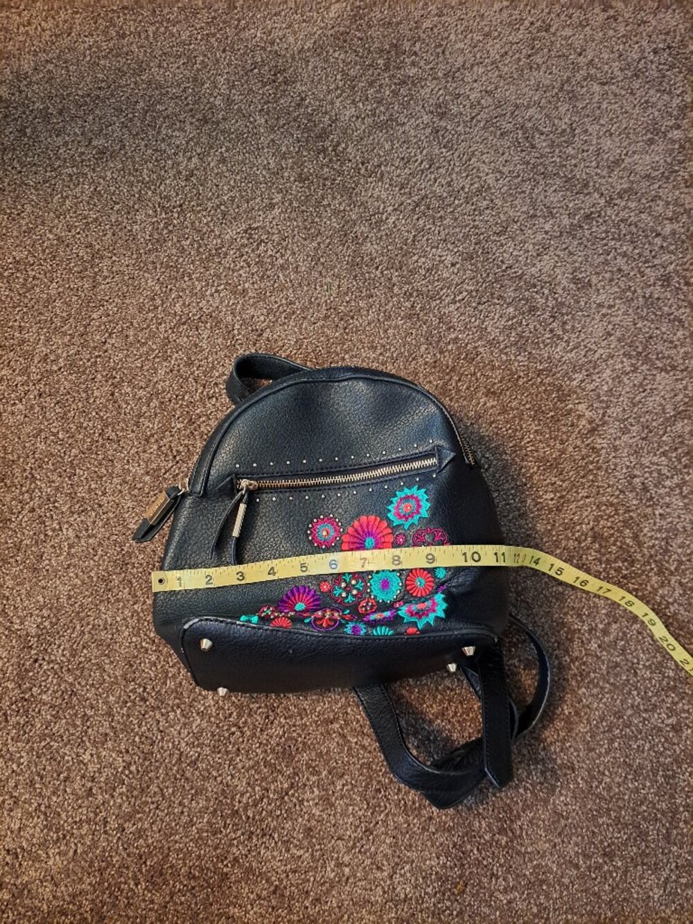 Black Steve Madden embroidered floral backpack with gold hardware. - Picture 7 of 13
